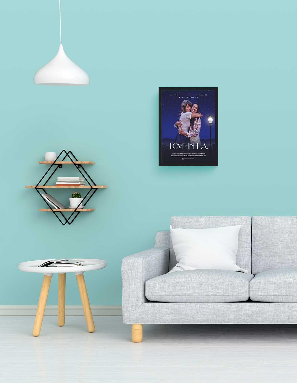 Love In LA love movie poster in a small black frame, on the wall above a grey sofa