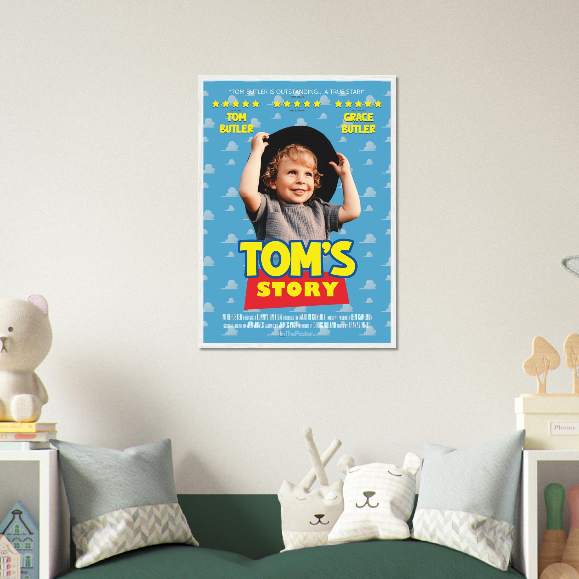 A Toy Story inspired movie poster design in a regular white frame, on a grey wall in a kids bedroom