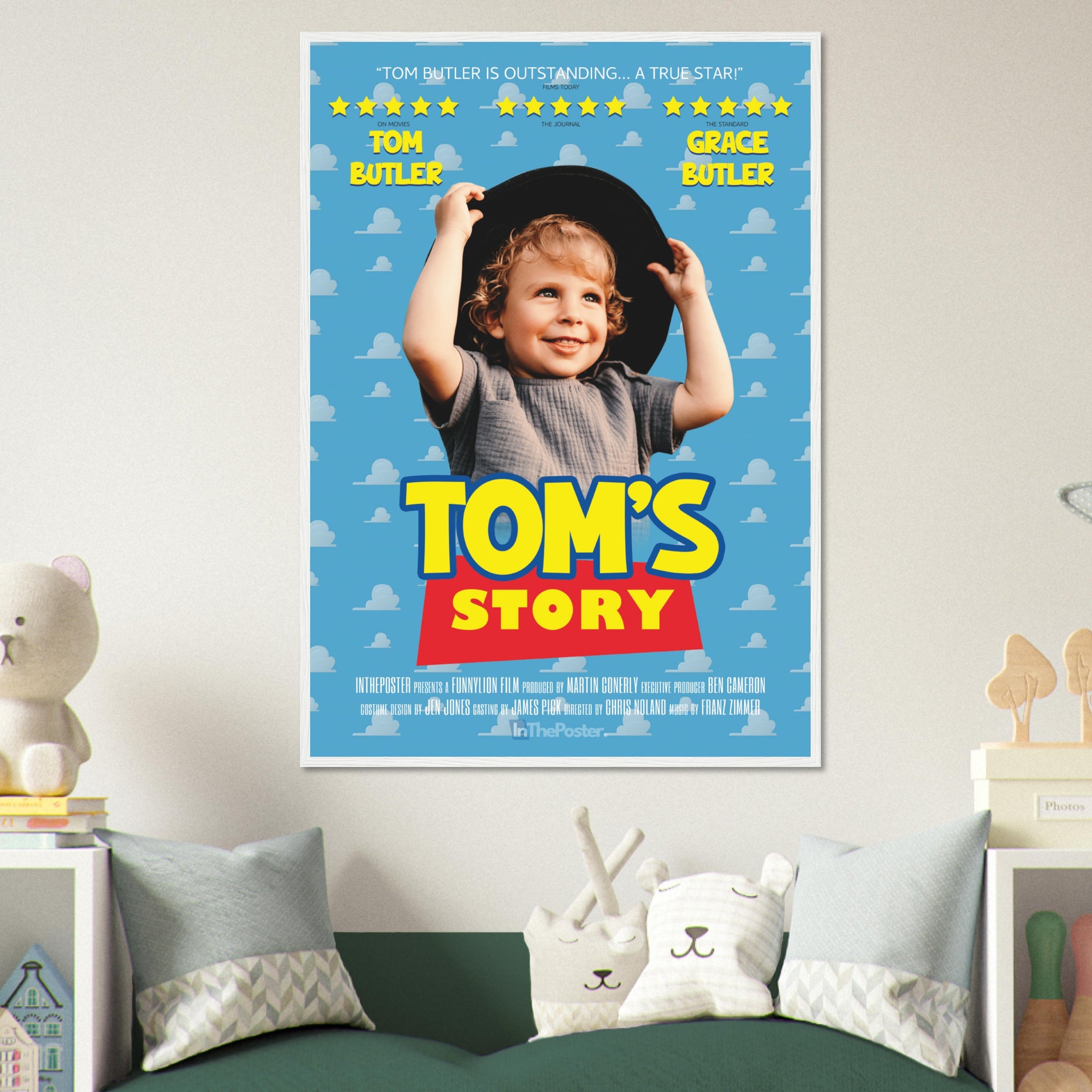 A Toy Story inspired movie poster design in an XL white frame, on a grey wall in a kids bedroom