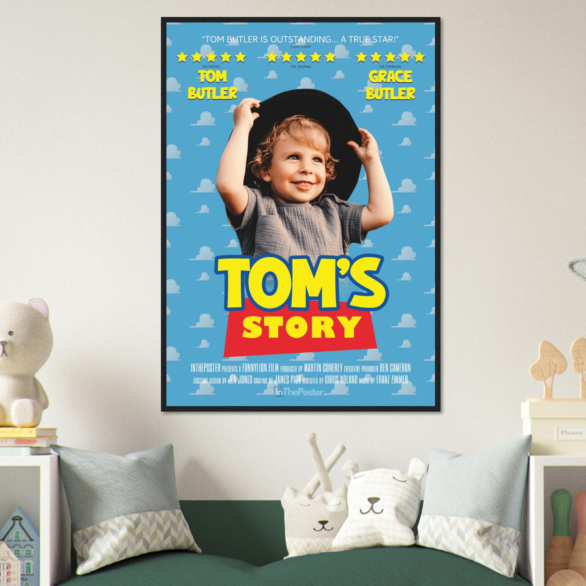 A Toy Story inspired movie poster design in a XL black frame, on a grey wall in a kids bedroom