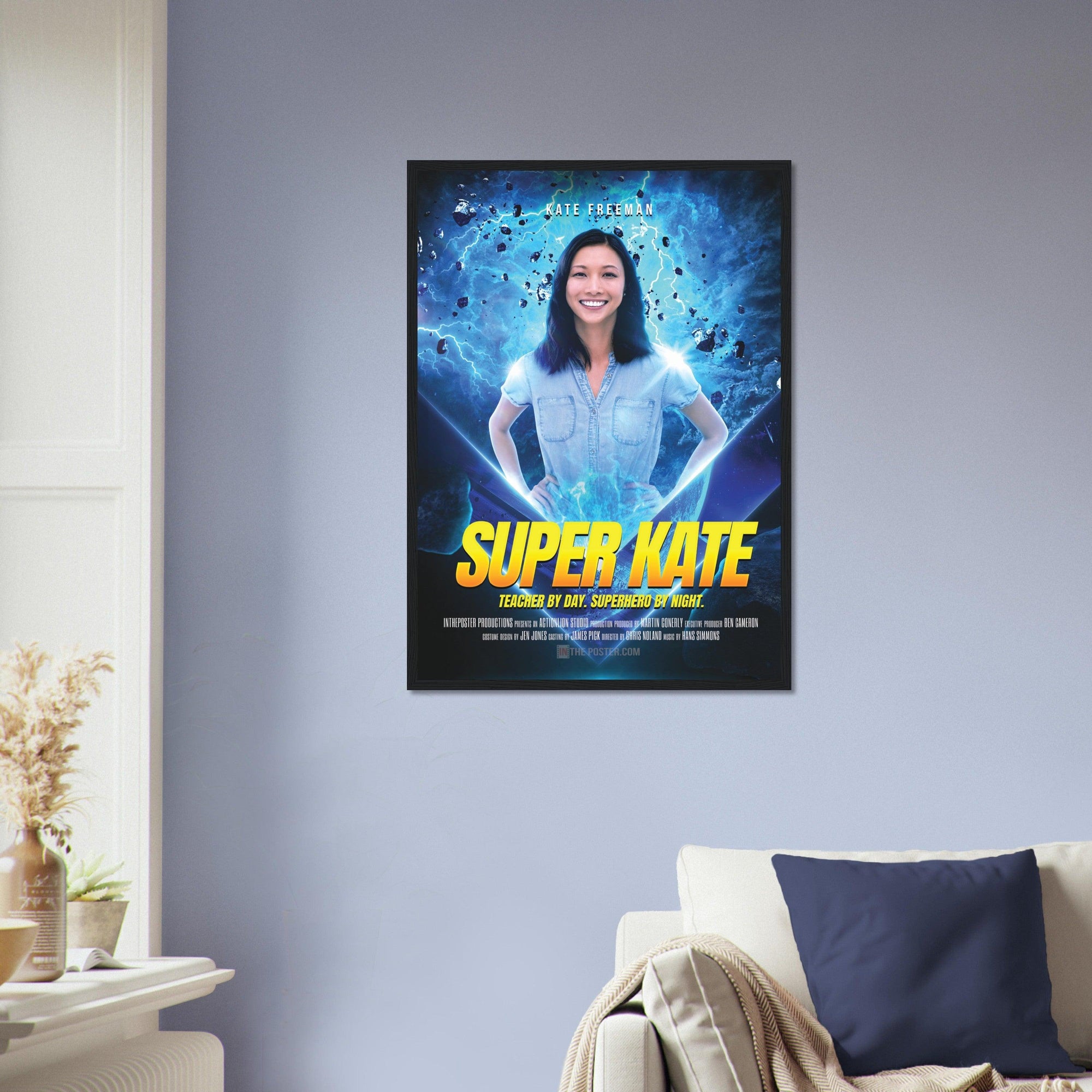 The Super Hero Custom Movie Poster design in a black frame in size regular, on the wall above a beige sofa and blue cushion