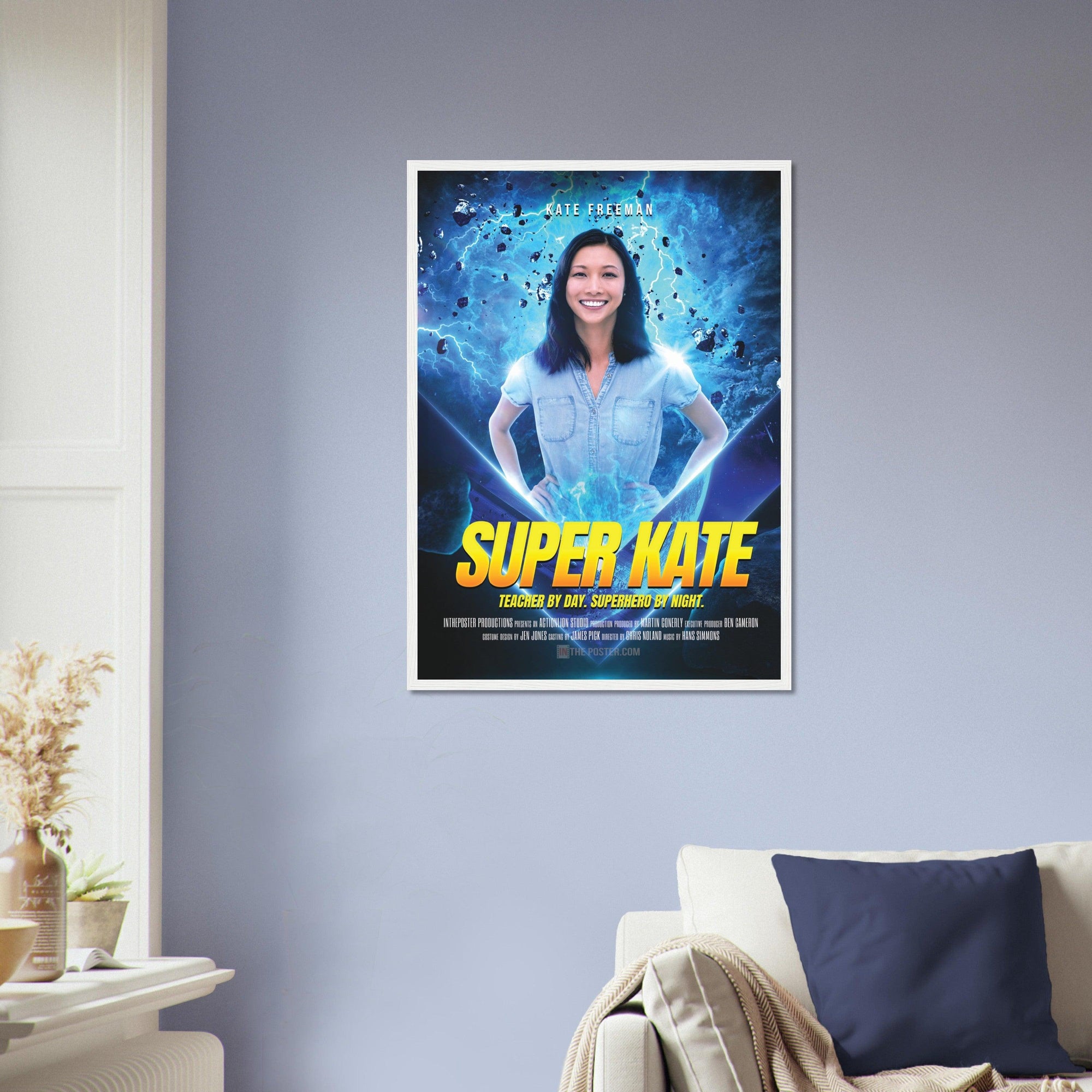 The Super Hero Custom Movie Poster design in a white frame in size regular, on the wall above a beige sofa and blue cushion
