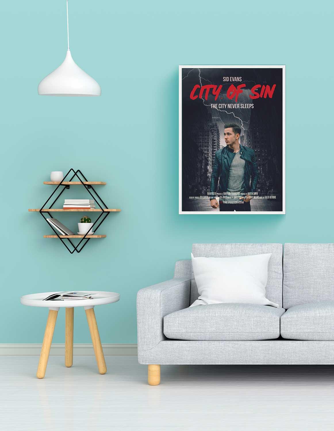 A personalized film noir movie poster in regular size in a white frame above a grey sofa