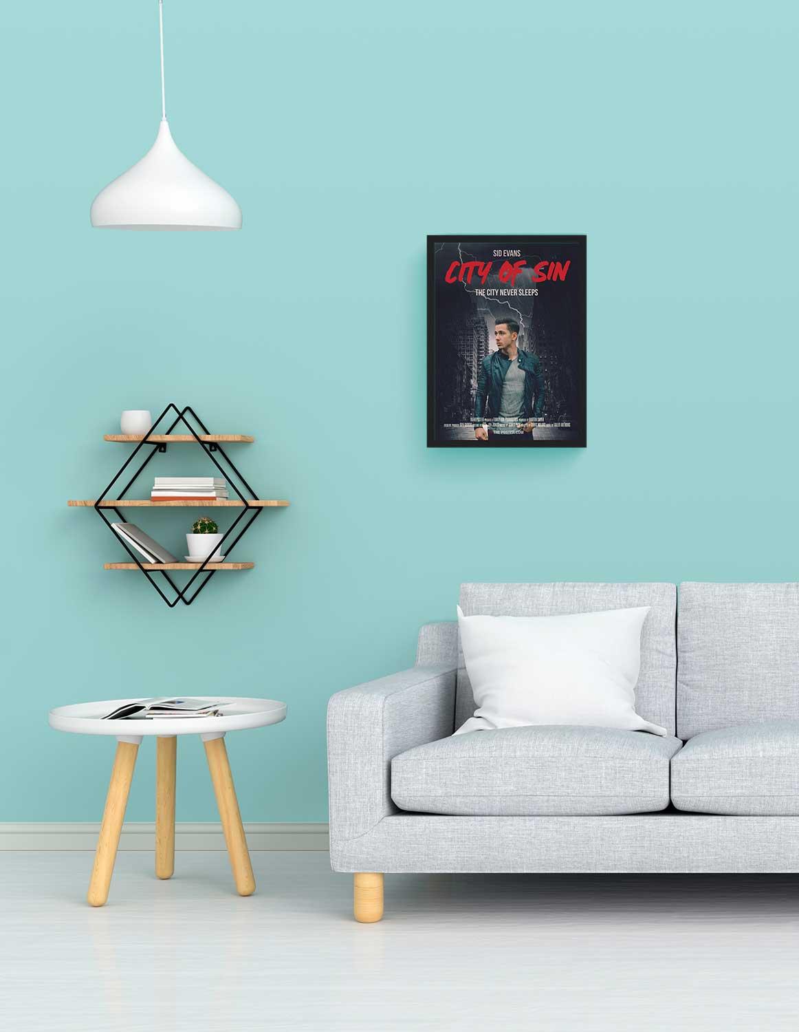 A personalized film noir movie poster in small size in a black frame above a grey sofa