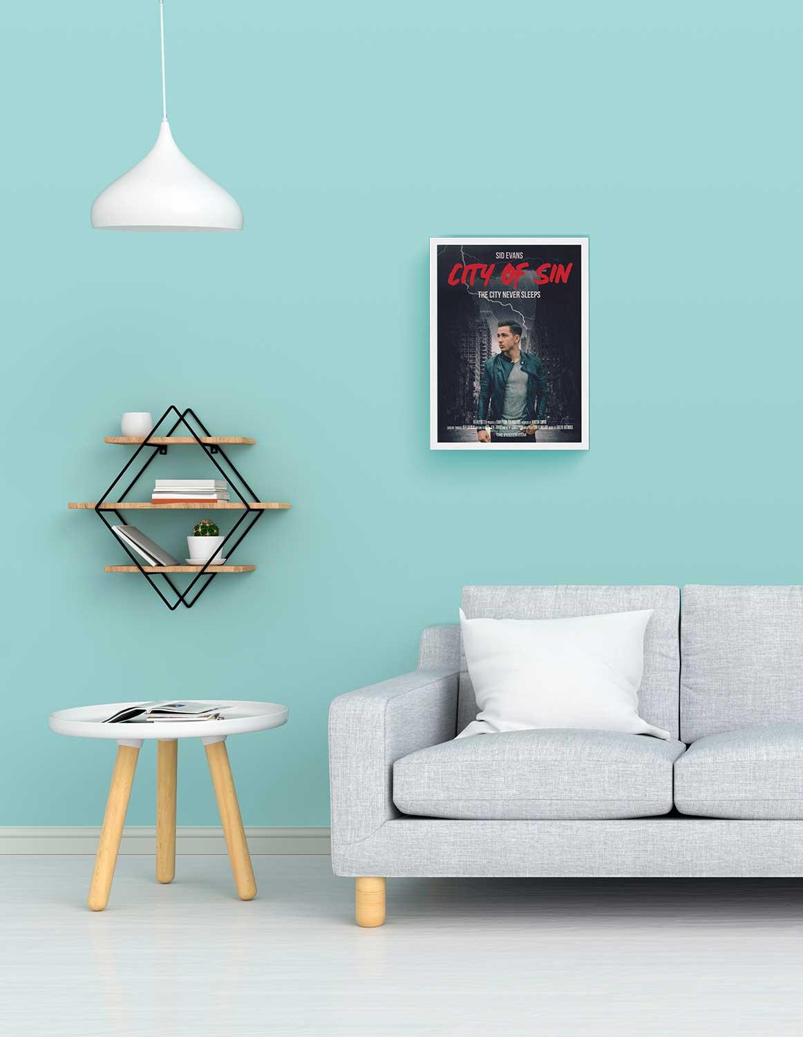 A personalized film noir movie poster in small size in a white frame above a grey sofa