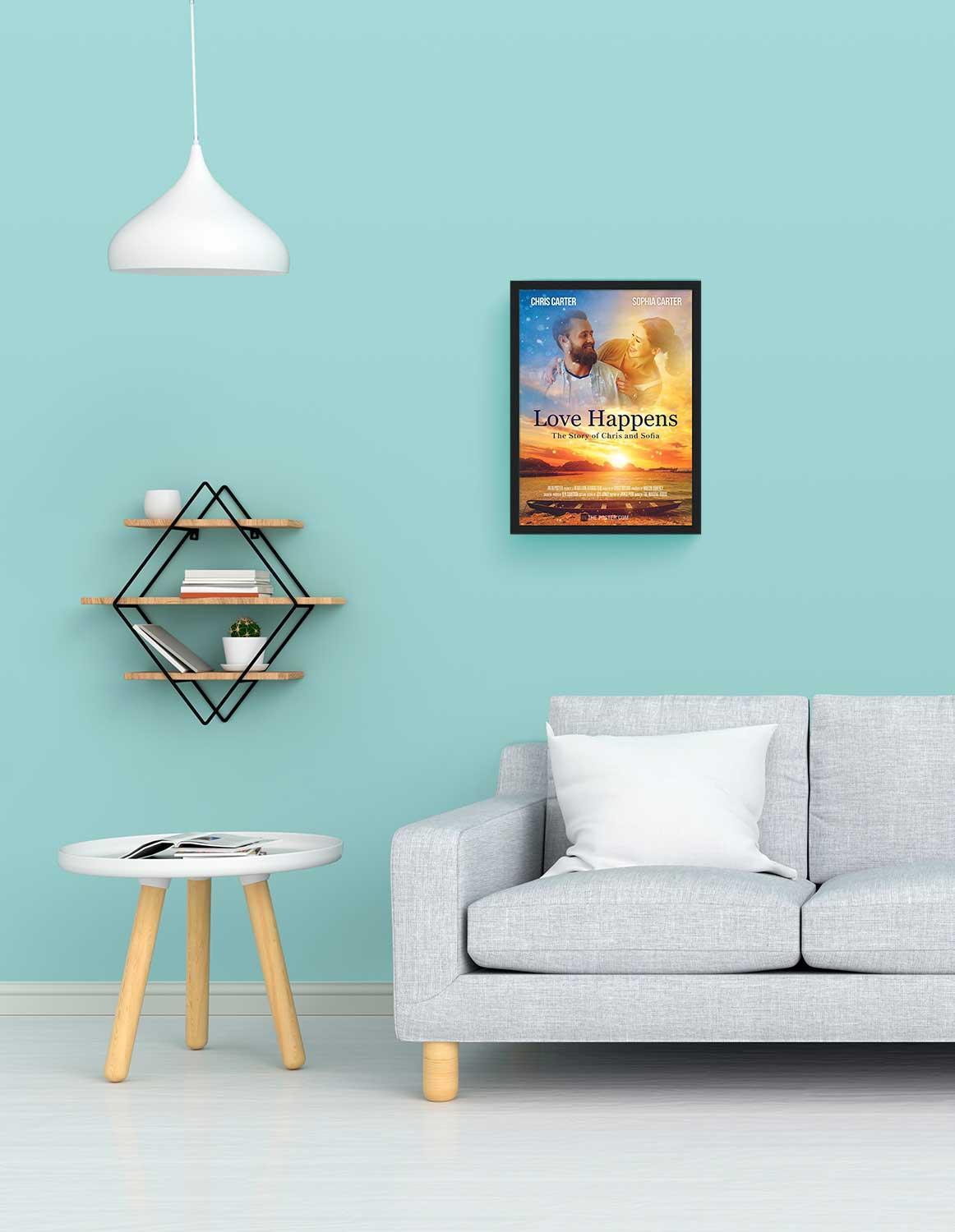 A romantic movie poster in a small size black frame above a grey sofa