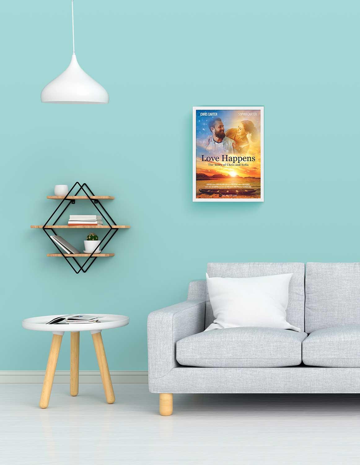 A romantic movie poster in a small size white frame above a grey sofa