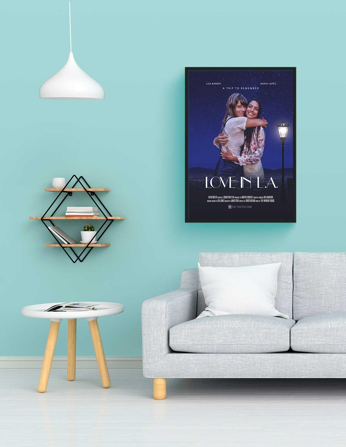 Love In LA romantic movie poster in a black frame, on the wall above a grey sofa