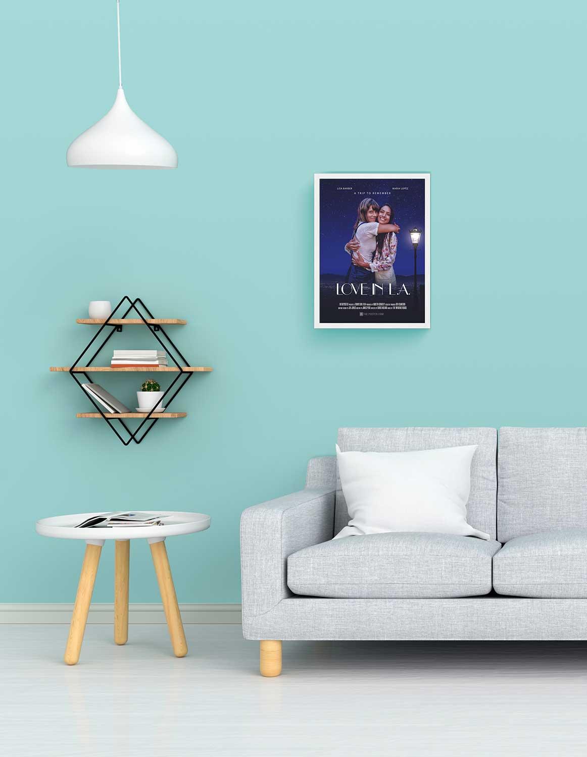 Love In LA love movie poster in a small white frame, on the wall above a grey sofa