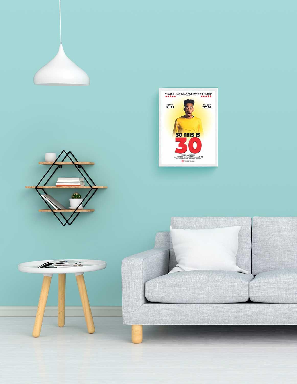So This is 30 - personalized comedy movie poster, small size, with a white frame on a wall above a sofa
