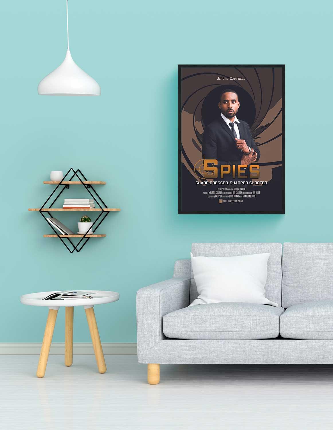 The spy movie poster in a regular black frame on the wall above a grey sofa
