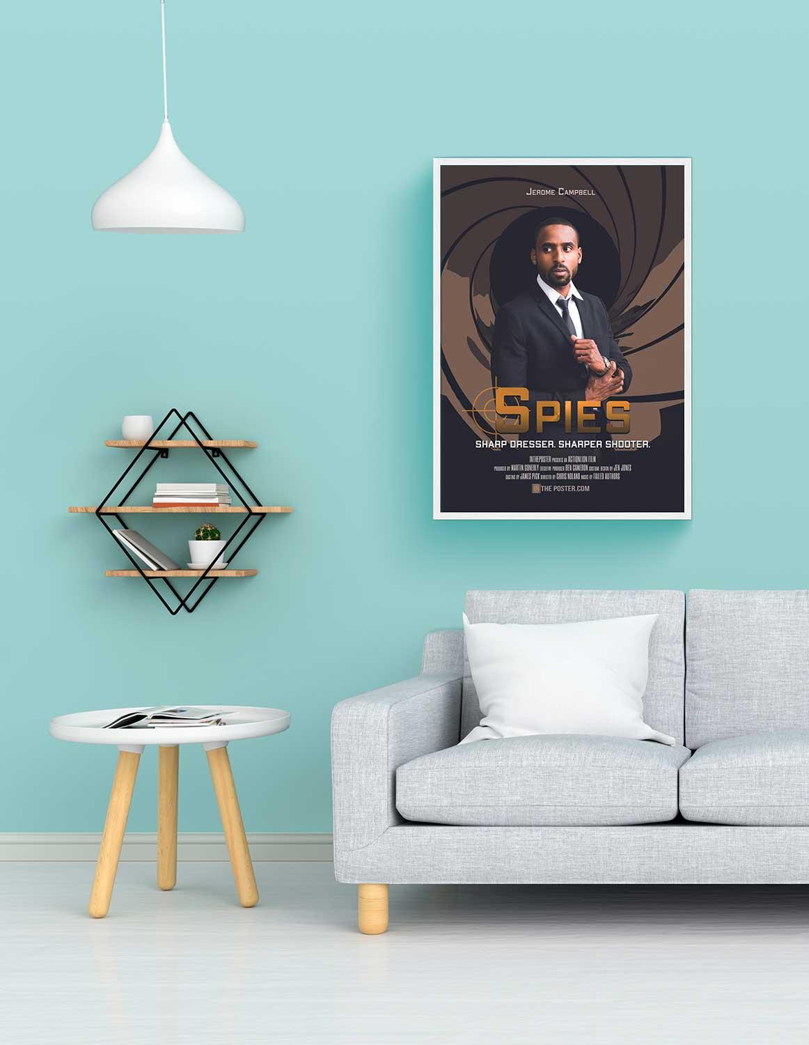 The spy movie poster in a regular white frame on the wall above a grey sofa