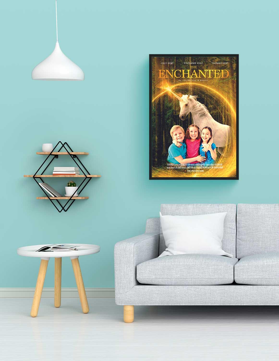 A unicorn movie poster in a regular black frame above a grey sofa