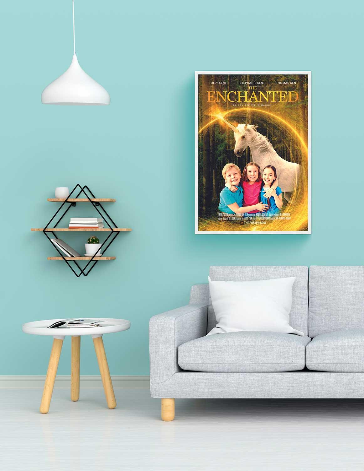 A unicorn movie poster in a regular white frame above a grey sofa