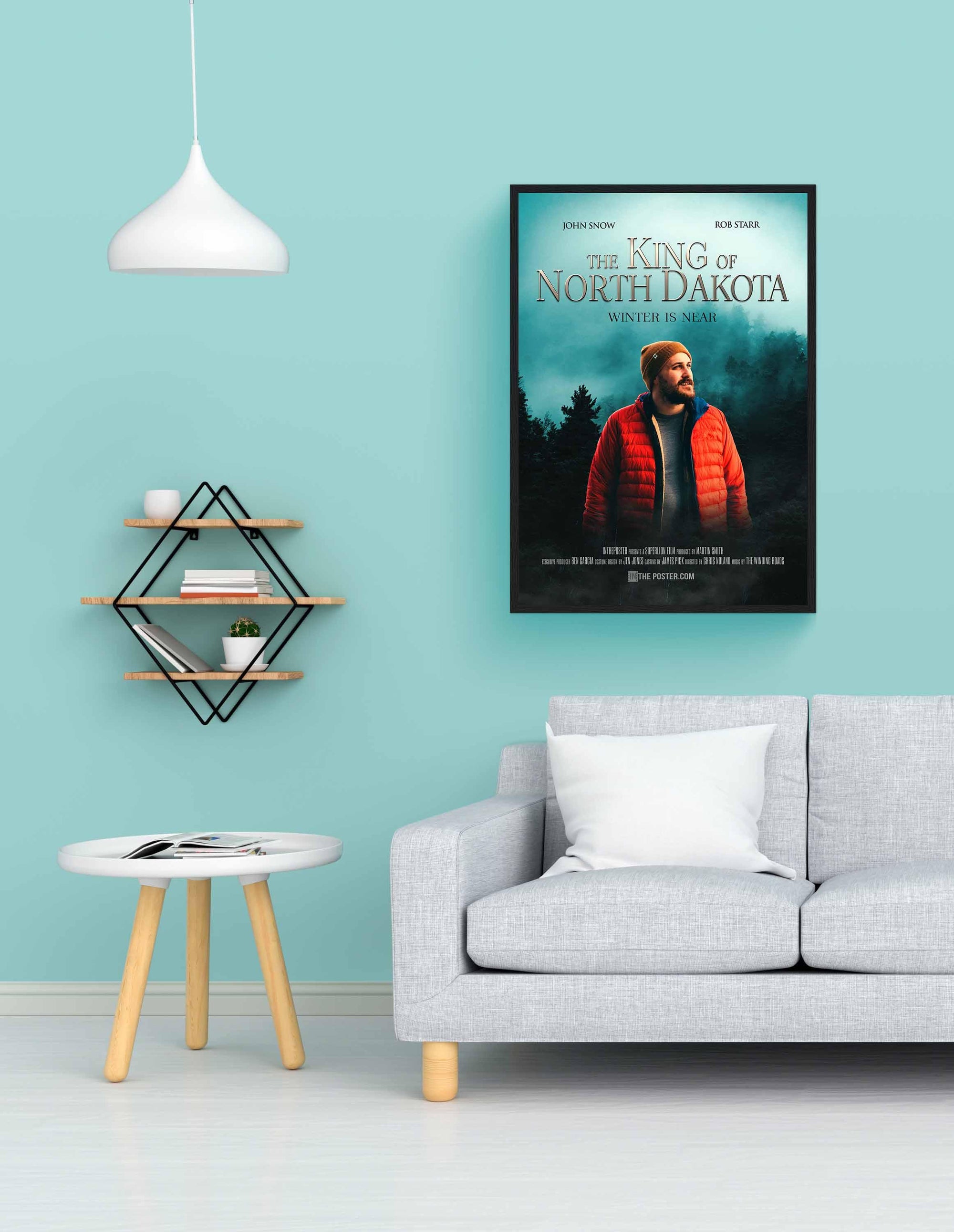 Fantasy custom movie poster in a black regular frame on a blue wall above a grey sofa