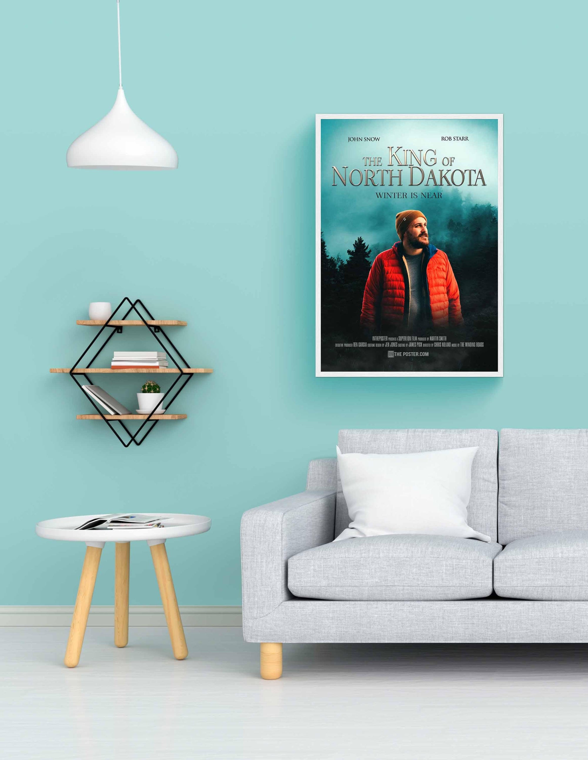 Fantasy custom movie poster in a white regular frame on a blue wall above a grey sofa