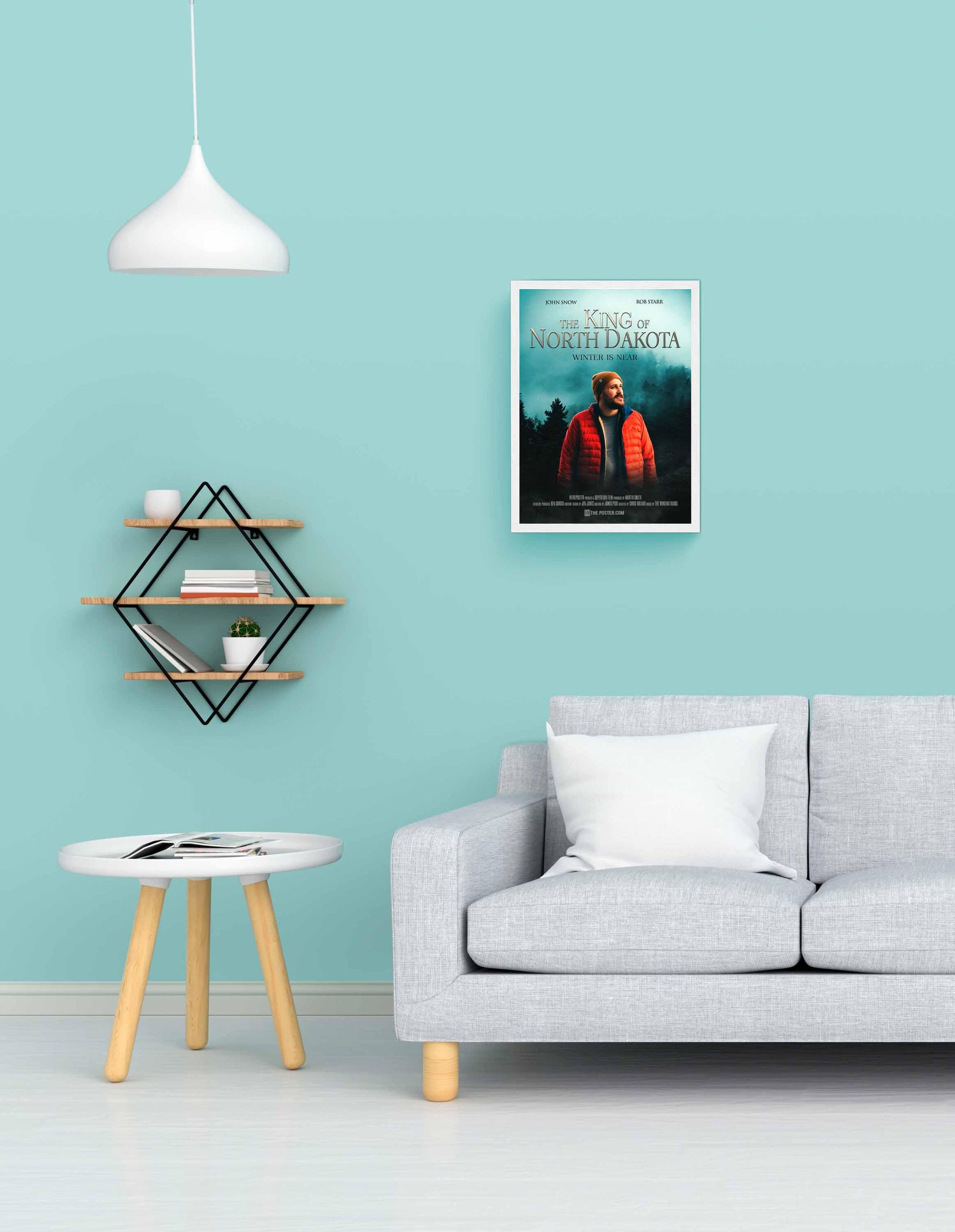 Fantasy custom movie poster in a white small frame on a blue wall above a grey sofa