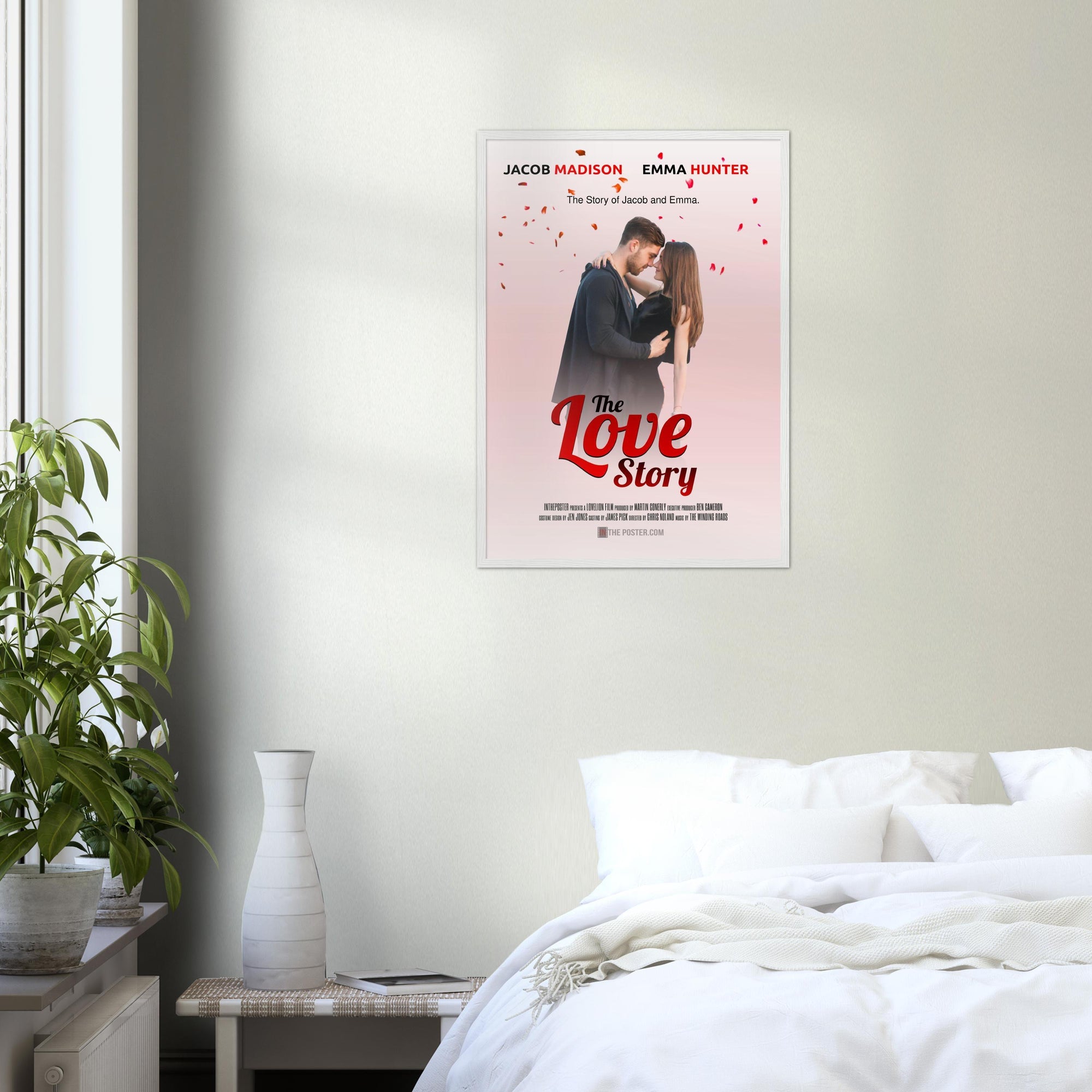 A bedroom wall with a regular white frame with a film poster called The Love Story