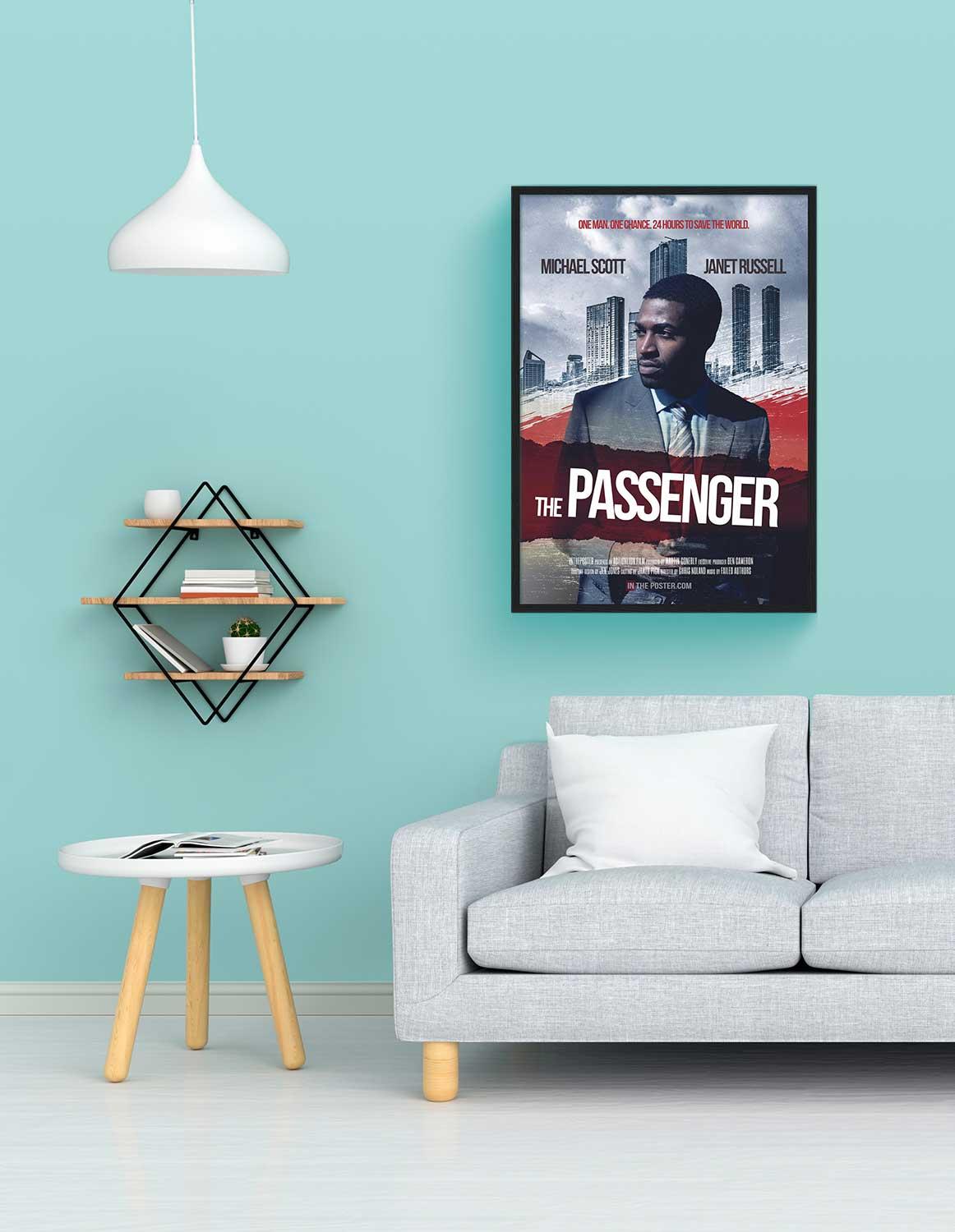 The thiller movie poster in a black frame on a blue wall above a sofa
