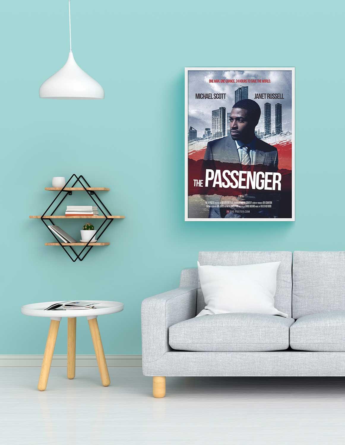 The thiller movie poster in a white frame on a blue wall above a sofa