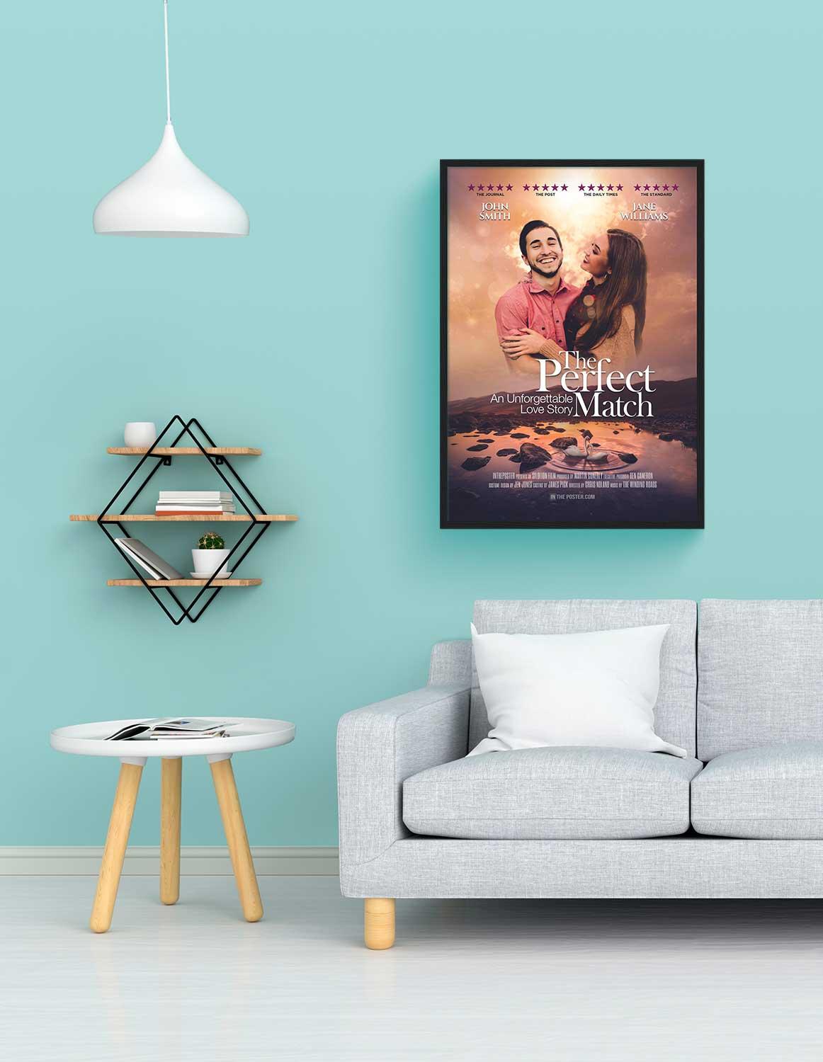 The perfect match romantic movie poster in a regular black frame on a blue wall above a grey modern sofa
