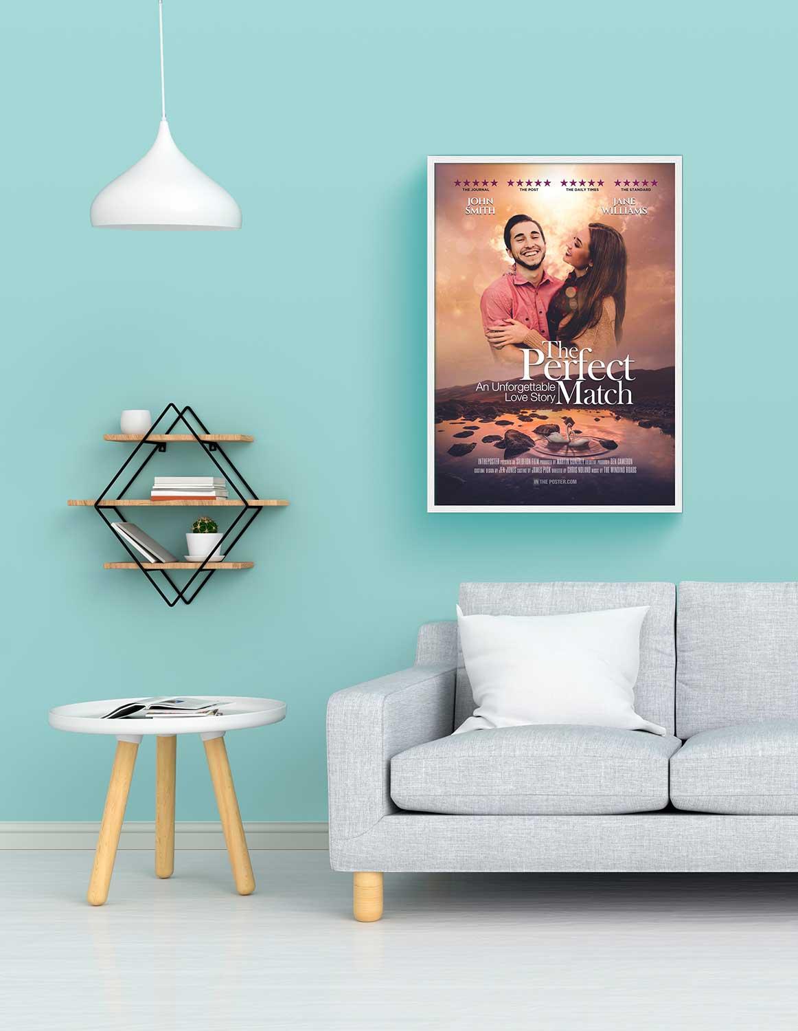 The perfect match romantic movie poster in a regular white frame on a blue wall above a grey modern sofa