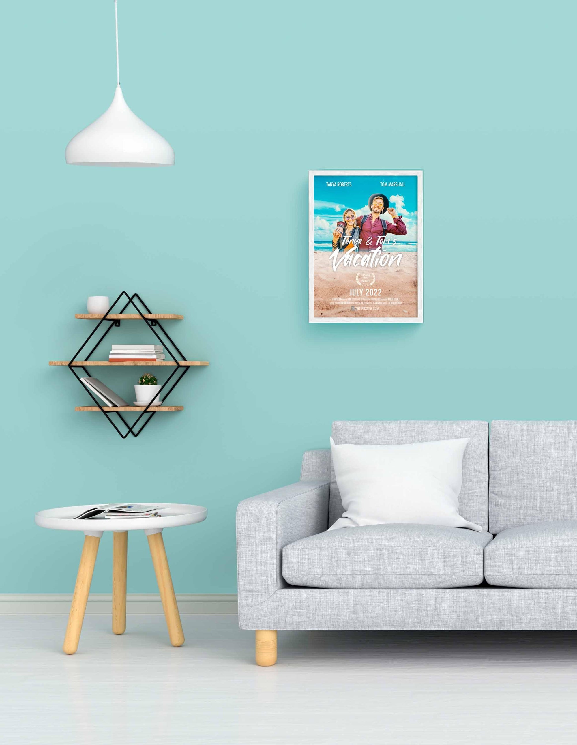 The Vacation - Travel Movie Poster in size small in a picture frame on a blue wall above a grey sofa