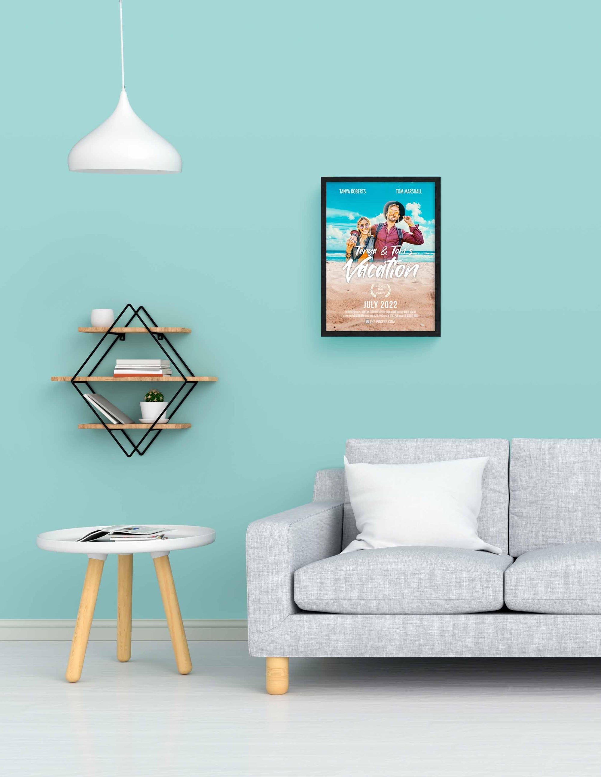 The Vacation - Travel Movie Poster in size small in a black picture frame on a blue wall above a grey sofa